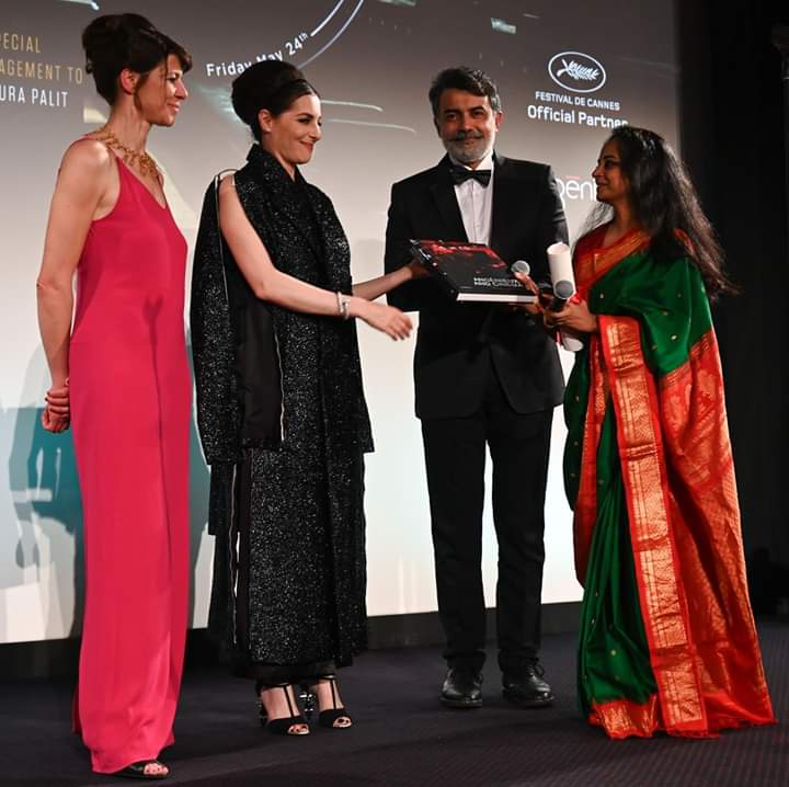 Modhura receiving Angenieux award at Cannes