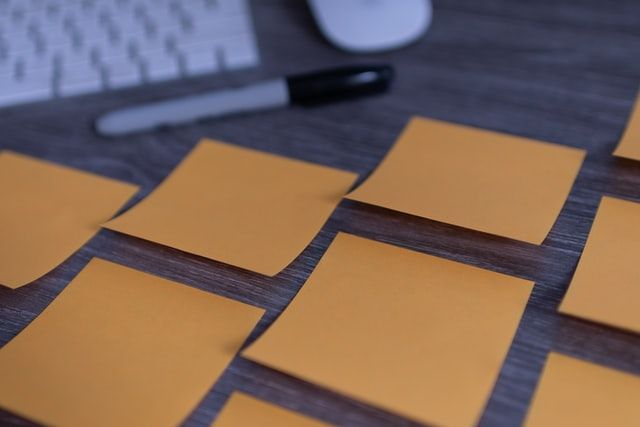 Yellow Sticky notes on the work desk. Credit - Unsplash